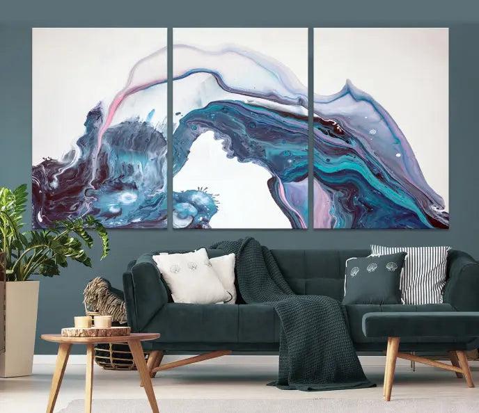 A stunning triptych of the "Colorful Marble Fluid Effect Wall Art Abstract Canvas Wall Art Print" in blue and purple hues hangs prominently in this modern living room.