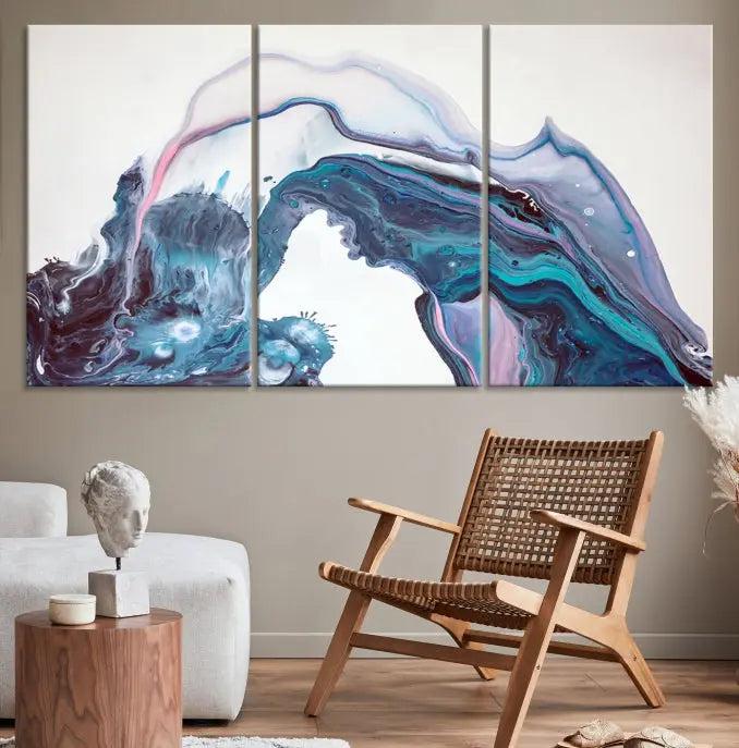 A stunning triptych of the "Colorful Marble Fluid Effect Wall Art Abstract Canvas Wall Art Print" in blue and purple hues hangs prominently in this modern living room.