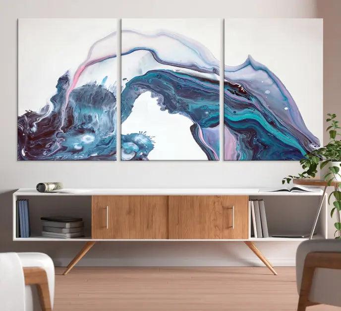 A stunning triptych of the "Colorful Marble Fluid Effect Wall Art Abstract Canvas Wall Art Print" in blue and purple hues hangs prominently in this modern living room.