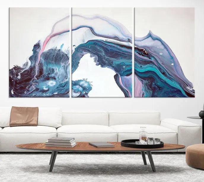 A stunning triptych of the "Colorful Marble Fluid Effect Wall Art Abstract Canvas Wall Art Print" in blue and purple hues hangs prominently in this modern living room.