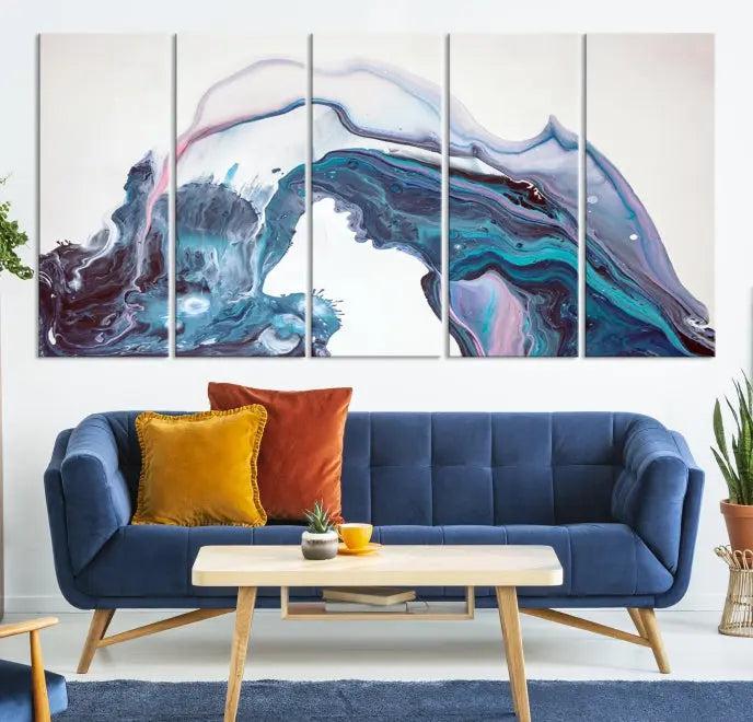 A stunning triptych of the "Colorful Marble Fluid Effect Wall Art Abstract Canvas Wall Art Print" in blue and purple hues hangs prominently in this modern living room.