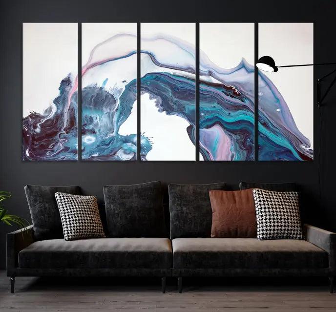 A stunning triptych of the "Colorful Marble Fluid Effect Wall Art Abstract Canvas Wall Art Print" in blue and purple hues hangs prominently in this modern living room.