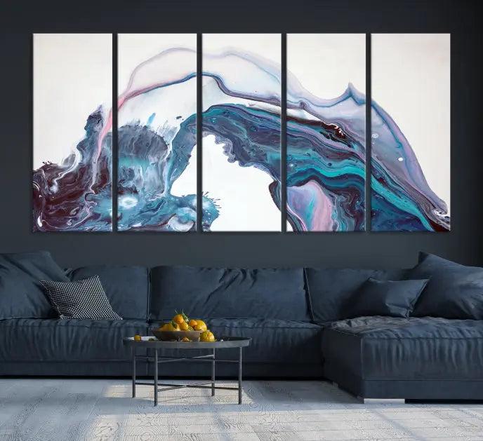 A stunning triptych of the "Colorful Marble Fluid Effect Wall Art Abstract Canvas Wall Art Print" in blue and purple hues hangs prominently in this modern living room.