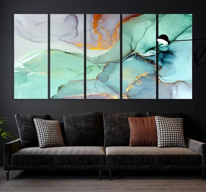 Contemporary living room featuring the Colorful Marble Fluid Effect Wall Art Abstract Canvas Wall Art Print, showcasing multi-panel abstract designs in teal, gold, and white tones. This museum-quality canvas artwork is ready to hang and finished with a UV-protective coating for enduring vibrancy.