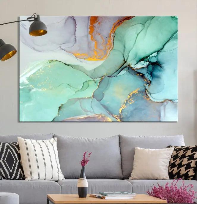 Contemporary living room featuring the Colorful Marble Fluid Effect Wall Art Abstract Canvas Wall Art Print, showcasing multi-panel abstract designs in teal, gold, and white tones. This museum-quality canvas artwork is ready to hang and finished with a UV-protective coating for enduring vibrancy.