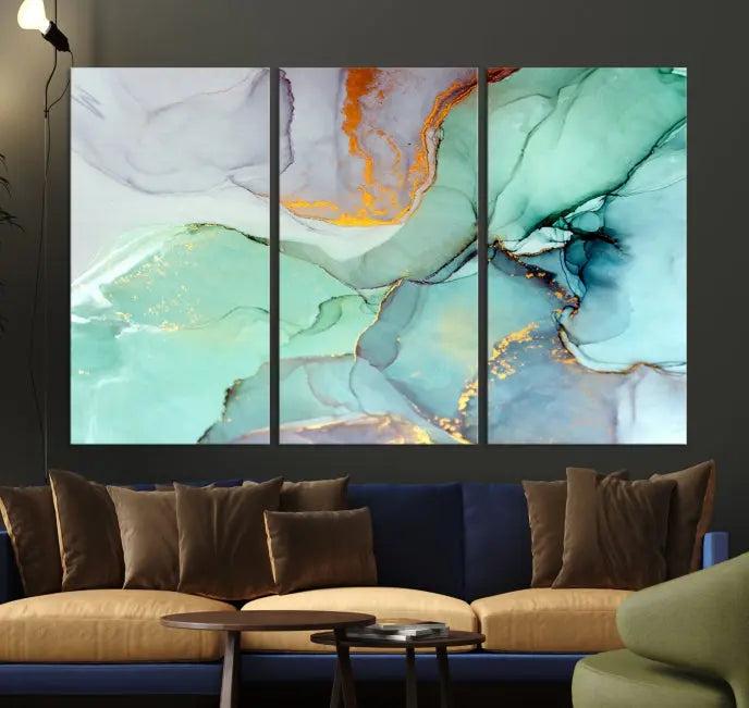 Contemporary living room featuring the Colorful Marble Fluid Effect Wall Art Abstract Canvas Wall Art Print, showcasing multi-panel abstract designs in teal, gold, and white tones. This museum-quality canvas artwork is ready to hang and finished with a UV-protective coating for enduring vibrancy.