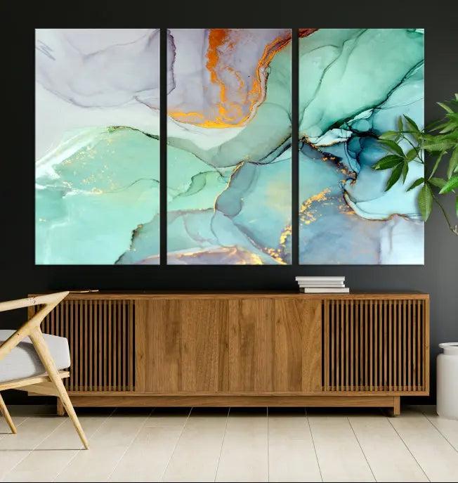 Contemporary living room featuring the Colorful Marble Fluid Effect Wall Art Abstract Canvas Wall Art Print, showcasing multi-panel abstract designs in teal, gold, and white tones. This museum-quality canvas artwork is ready to hang and finished with a UV-protective coating for enduring vibrancy.