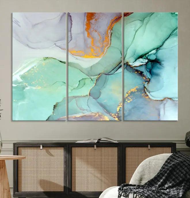 Contemporary living room featuring the Colorful Marble Fluid Effect Wall Art Abstract Canvas Wall Art Print, showcasing multi-panel abstract designs in teal, gold, and white tones. This museum-quality canvas artwork is ready to hang and finished with a UV-protective coating for enduring vibrancy.