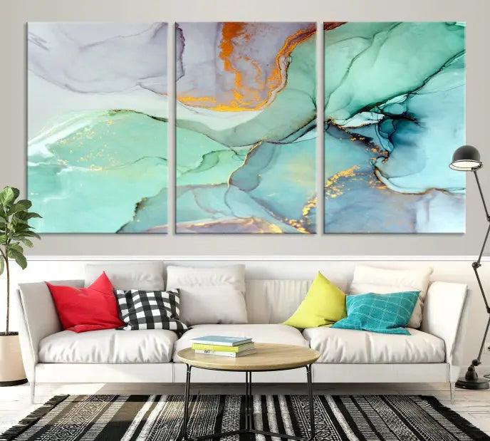 Contemporary living room featuring the Colorful Marble Fluid Effect Wall Art Abstract Canvas Wall Art Print, showcasing multi-panel abstract designs in teal, gold, and white tones. This museum-quality canvas artwork is ready to hang and finished with a UV-protective coating for enduring vibrancy.