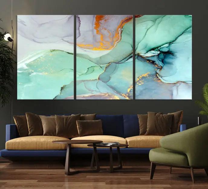 Contemporary living room featuring the Colorful Marble Fluid Effect Wall Art Abstract Canvas Wall Art Print, showcasing multi-panel abstract designs in teal, gold, and white tones. This museum-quality canvas artwork is ready to hang and finished with a UV-protective coating for enduring vibrancy.