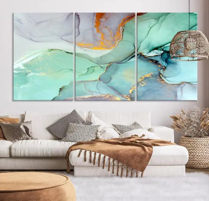 Contemporary living room featuring the Colorful Marble Fluid Effect Wall Art Abstract Canvas Wall Art Print, showcasing multi-panel abstract designs in teal, gold, and white tones. This museum-quality canvas artwork is ready to hang and finished with a UV-protective coating for enduring vibrancy.