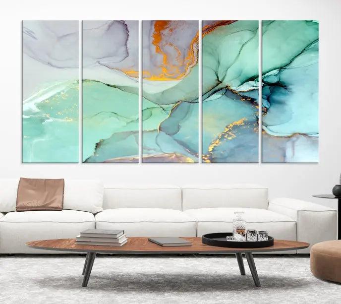 Contemporary living room featuring the Colorful Marble Fluid Effect Wall Art Abstract Canvas Wall Art Print, showcasing multi-panel abstract designs in teal, gold, and white tones. This museum-quality canvas artwork is ready to hang and finished with a UV-protective coating for enduring vibrancy.