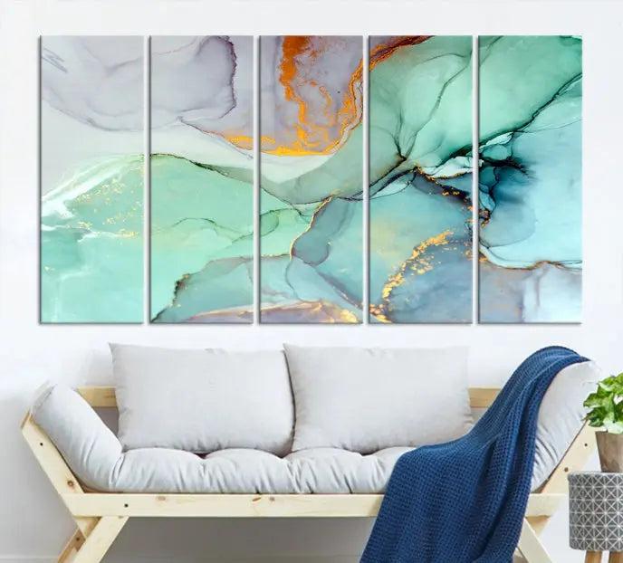 Contemporary living room featuring the Colorful Marble Fluid Effect Wall Art Abstract Canvas Wall Art Print, showcasing multi-panel abstract designs in teal, gold, and white tones. This museum-quality canvas artwork is ready to hang and finished with a UV-protective coating for enduring vibrancy.