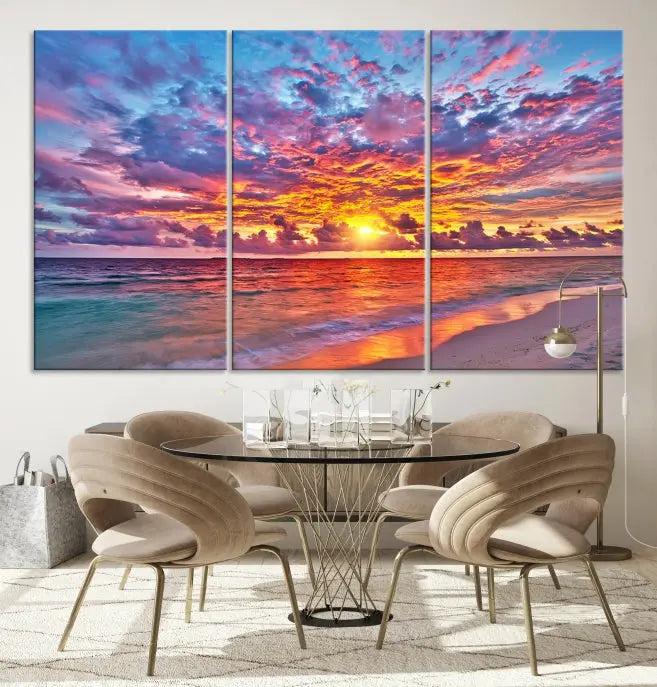 The Colorful Sunset Seashore Wall Art Canvas Print, featuring a triptych of a vibrant ocean sunset on gallery-wrapped museum-quality canvas, adorns the wall.