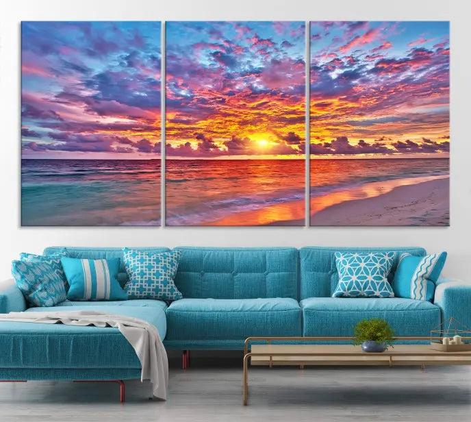 The Colorful Sunset Seashore Wall Art Canvas Print, featuring a triptych of a vibrant ocean sunset on gallery-wrapped museum-quality canvas, adorns the wall.