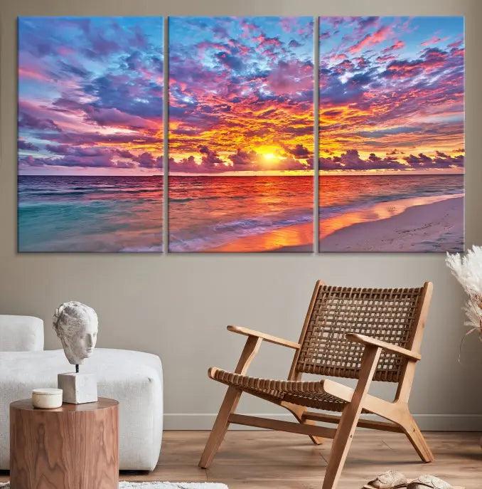 The Colorful Sunset Seashore Wall Art Canvas Print, featuring a triptych of a vibrant ocean sunset on gallery-wrapped museum-quality canvas, adorns the wall.