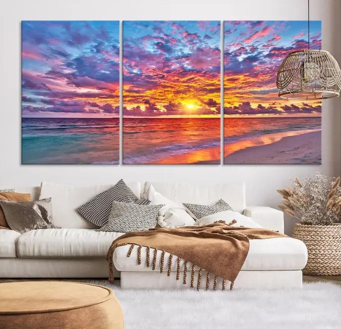 The Colorful Sunset Seashore Wall Art Canvas Print, featuring a triptych of a vibrant ocean sunset on gallery-wrapped museum-quality canvas, adorns the wall.