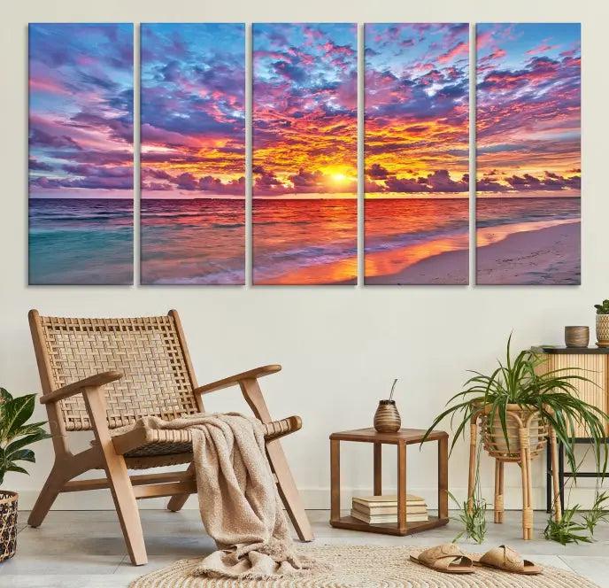 The Colorful Sunset Seashore Wall Art Canvas Print, featuring a triptych of a vibrant ocean sunset on gallery-wrapped museum-quality canvas, adorns the wall.