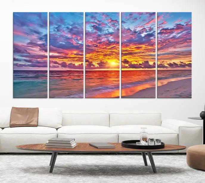 The Colorful Sunset Seashore Wall Art Canvas Print, featuring a triptych of a vibrant ocean sunset on gallery-wrapped museum-quality canvas, adorns the wall.