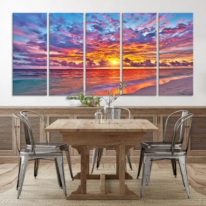 The Colorful Sunset Seashore Wall Art Canvas Print, featuring a triptych of a vibrant ocean sunset on gallery-wrapped museum-quality canvas, adorns the wall.