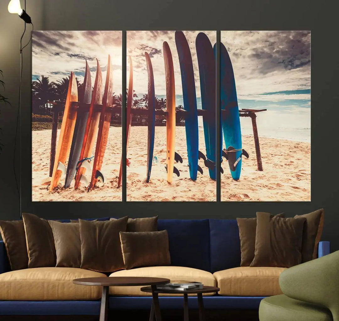 A three-panel canvas wall art titled "Colorful Surfing Boards and Sunset Canvas Wall Art Print Canvas Print" features surfboards on a sandy beach. This piece is crafted on gallery-wrapped, museum-quality canvas with a UV-protective coating.