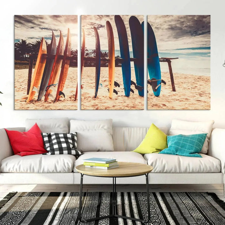 A three-panel canvas wall art titled "Colorful Surfing Boards and Sunset Canvas Wall Art Print Canvas Print" features surfboards on a sandy beach. This piece is crafted on gallery-wrapped, museum-quality canvas with a UV-protective coating.