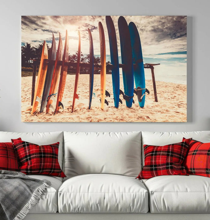 A three-panel canvas wall art titled "Colorful Surfing Boards and Sunset Canvas Wall Art Print Canvas Print" features surfboards on a sandy beach. This piece is crafted on gallery-wrapped, museum-quality canvas with a UV-protective coating.