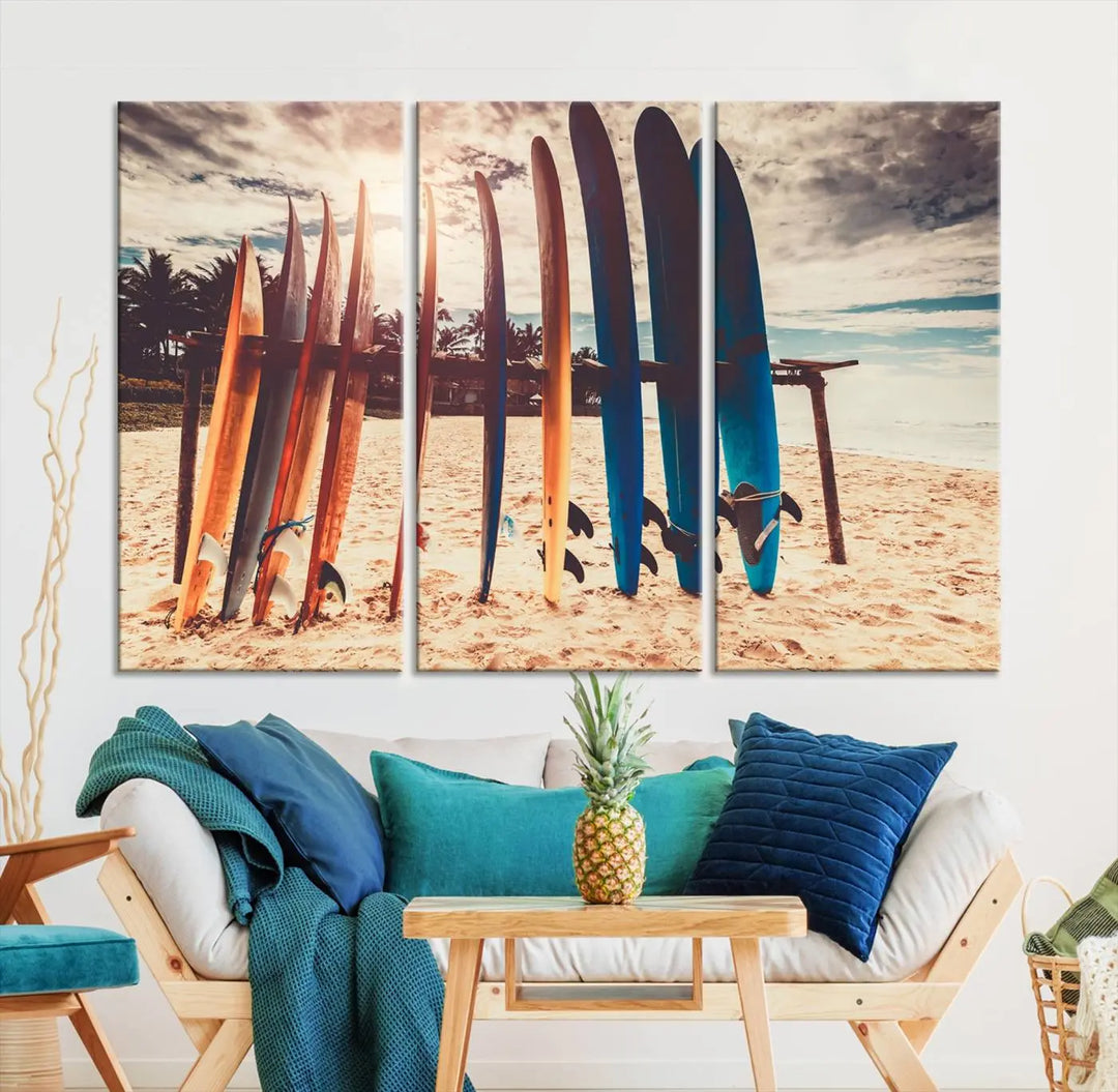 A three-panel canvas wall art titled "Colorful Surfing Boards and Sunset Canvas Wall Art Print Canvas Print" features surfboards on a sandy beach. This piece is crafted on gallery-wrapped, museum-quality canvas with a UV-protective coating.