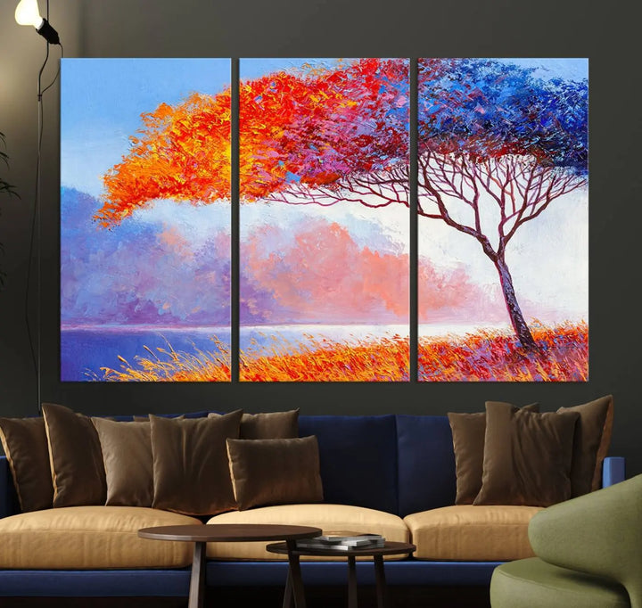 The Colorful Tree Wall Art Canvas is a vibrant, multi-panel painting depicting a colorful tree by a lake. It is crafted on museum-quality canvas and comes ready to hang.