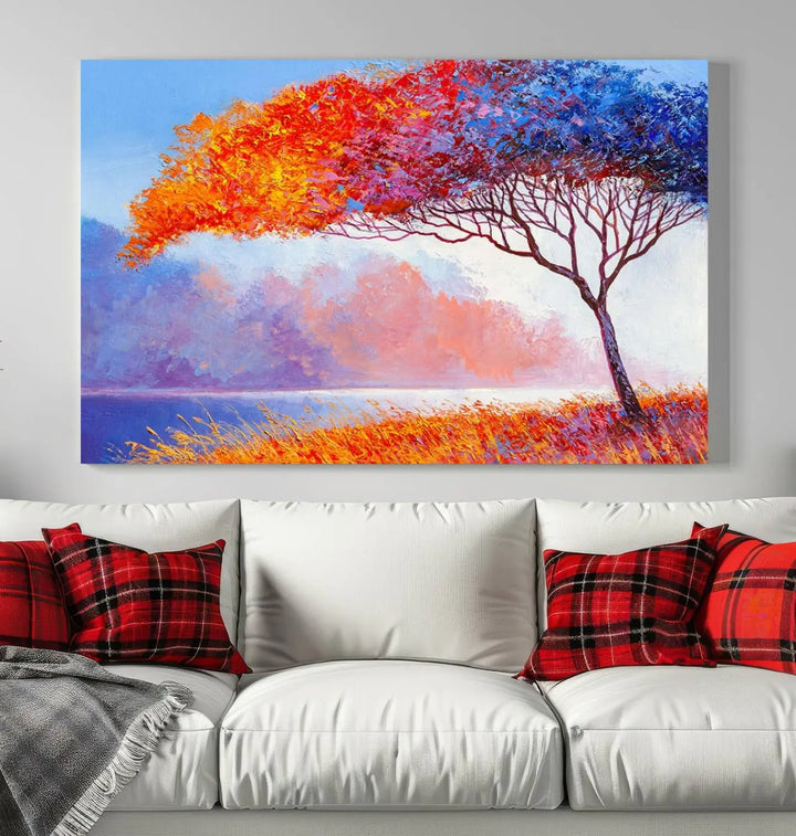 The Colorful Tree Wall Art Canvas is a vibrant, multi-panel painting depicting a colorful tree by a lake. It is crafted on museum-quality canvas and comes ready to hang.