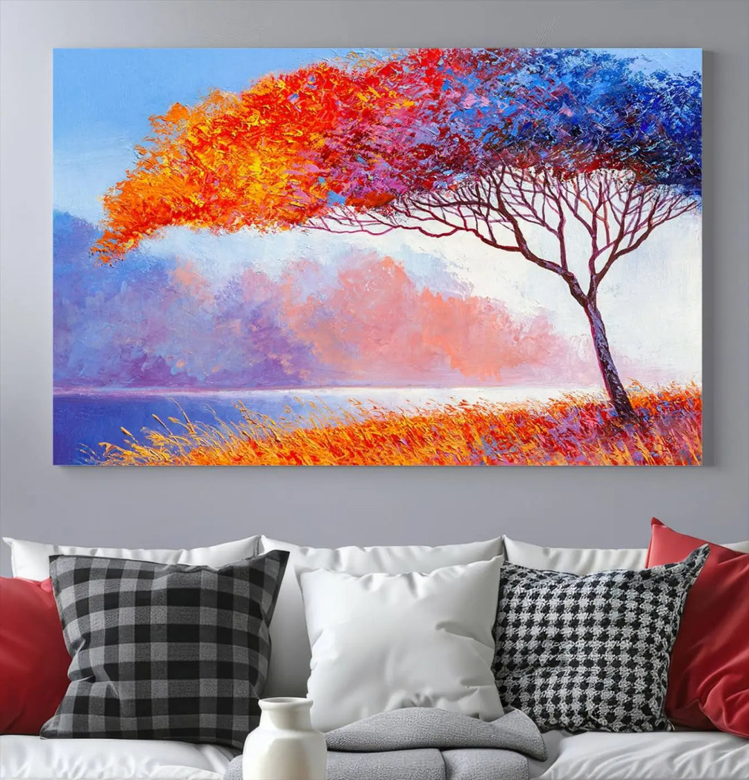 The Colorful Tree Wall Art Canvas is a vibrant, multi-panel painting depicting a colorful tree by a lake. It is crafted on museum-quality canvas and comes ready to hang.