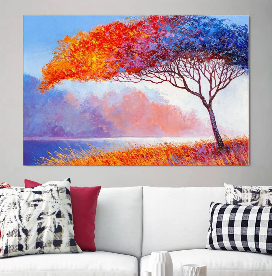 The Colorful Tree Wall Art Canvas is a vibrant, multi-panel painting depicting a colorful tree by a lake. It is crafted on museum-quality canvas and comes ready to hang.