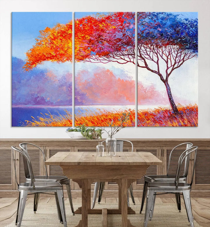 The Colorful Tree Wall Art Canvas is a vibrant, multi-panel painting depicting a colorful tree by a lake. It is crafted on museum-quality canvas and comes ready to hang.