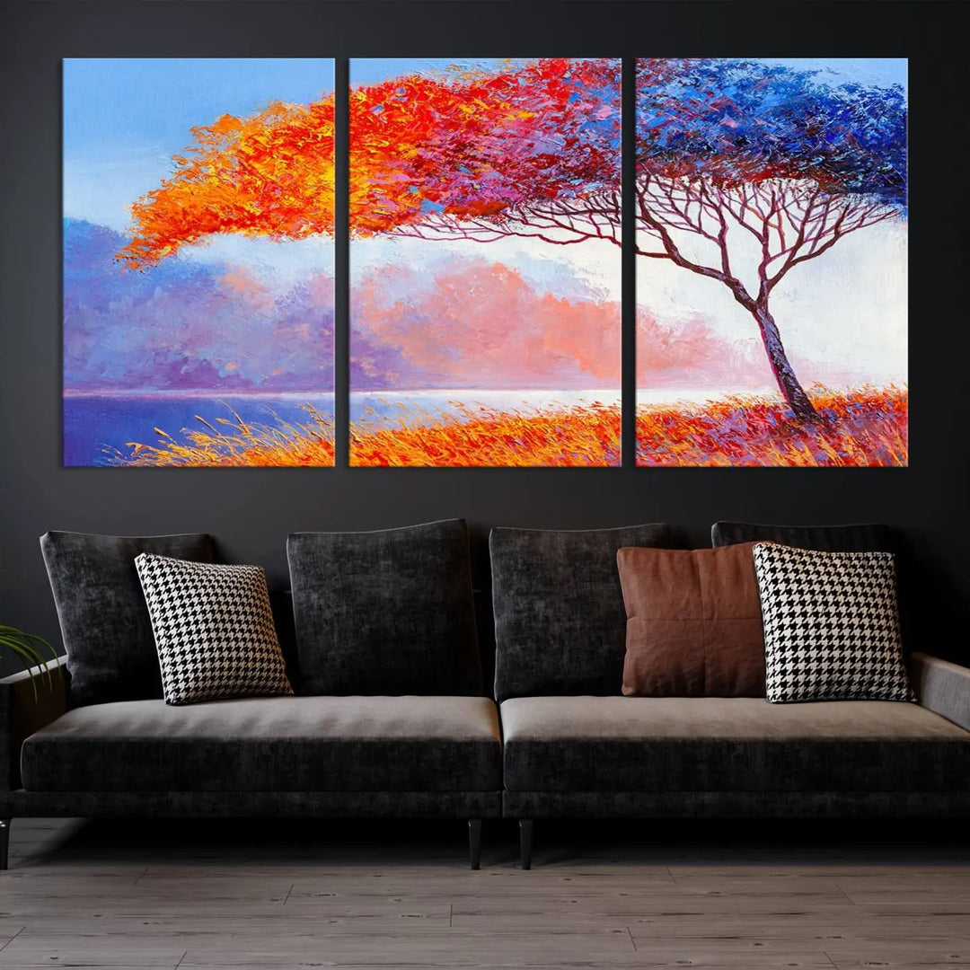 The Colorful Tree Wall Art Canvas is a vibrant, multi-panel painting depicting a colorful tree by a lake. It is crafted on museum-quality canvas and comes ready to hang.