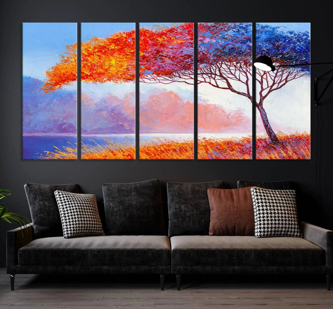 The Colorful Tree Wall Art Canvas is a vibrant, multi-panel painting depicting a colorful tree by a lake. It is crafted on museum-quality canvas and comes ready to hang.