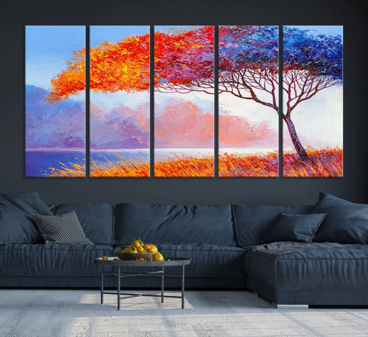 The Colorful Tree Wall Art Canvas is a vibrant, multi-panel painting depicting a colorful tree by a lake. It is crafted on museum-quality canvas and comes ready to hang.