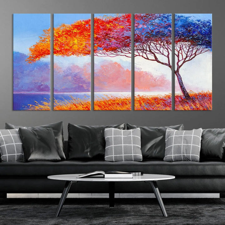 The Colorful Tree Wall Art Canvas is a vibrant, multi-panel painting depicting a colorful tree by a lake. It is crafted on museum-quality canvas and comes ready to hang.