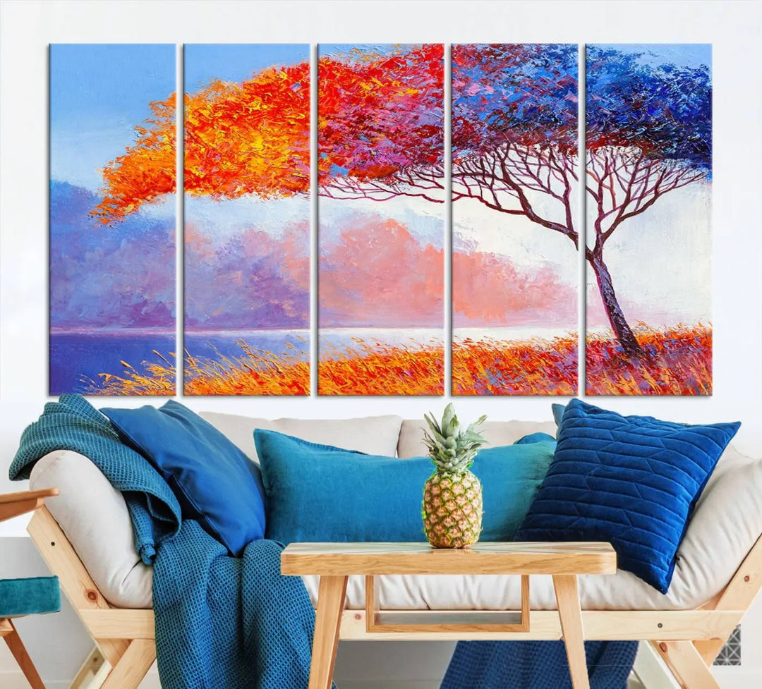 The Colorful Tree Wall Art Canvas is a vibrant, multi-panel painting depicting a colorful tree by a lake. It is crafted on museum-quality canvas and comes ready to hang.