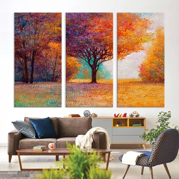 The "Colorful Tree in Autumn" wall art canvas print features a three-panel depiction of a vibrant autumn landscape, gallery wrapped on museum-quality polycotton with UV-protective coating, enhancing the wall in a stylish living room.