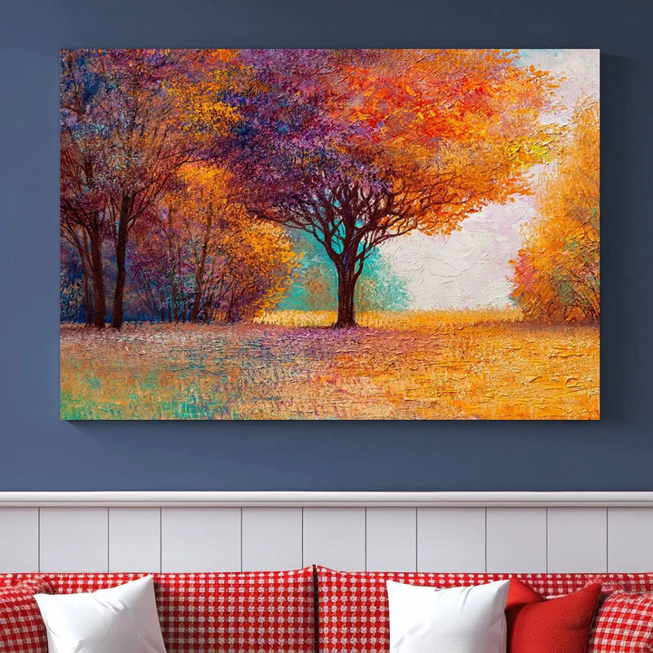 The "Colorful Tree in Autumn" wall art canvas print features a three-panel depiction of a vibrant autumn landscape, gallery wrapped on museum-quality polycotton with UV-protective coating, enhancing the wall in a stylish living room.