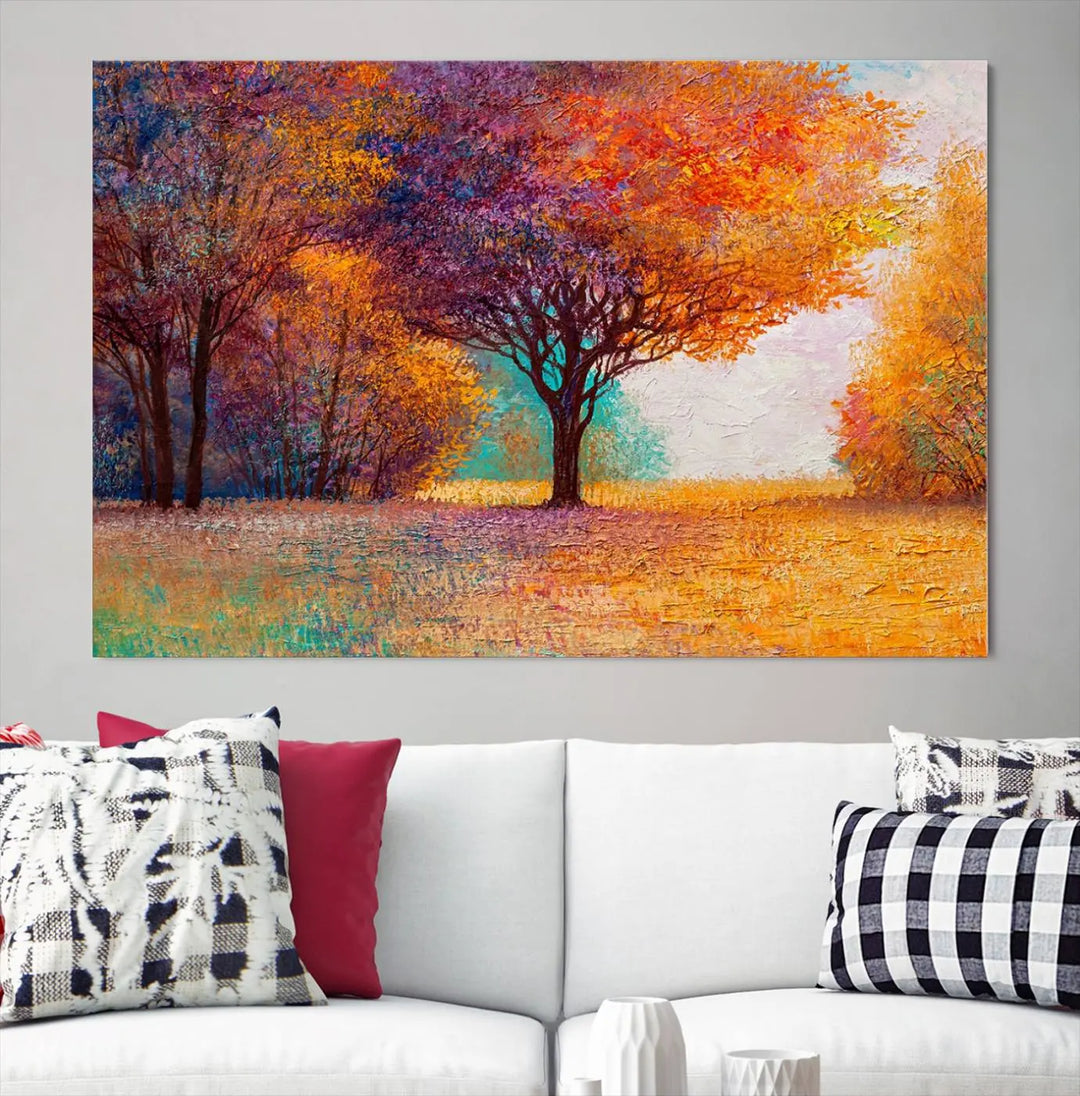 The "Colorful Tree in Autumn" wall art canvas print features a three-panel depiction of a vibrant autumn landscape, gallery wrapped on museum-quality polycotton with UV-protective coating, enhancing the wall in a stylish living room.