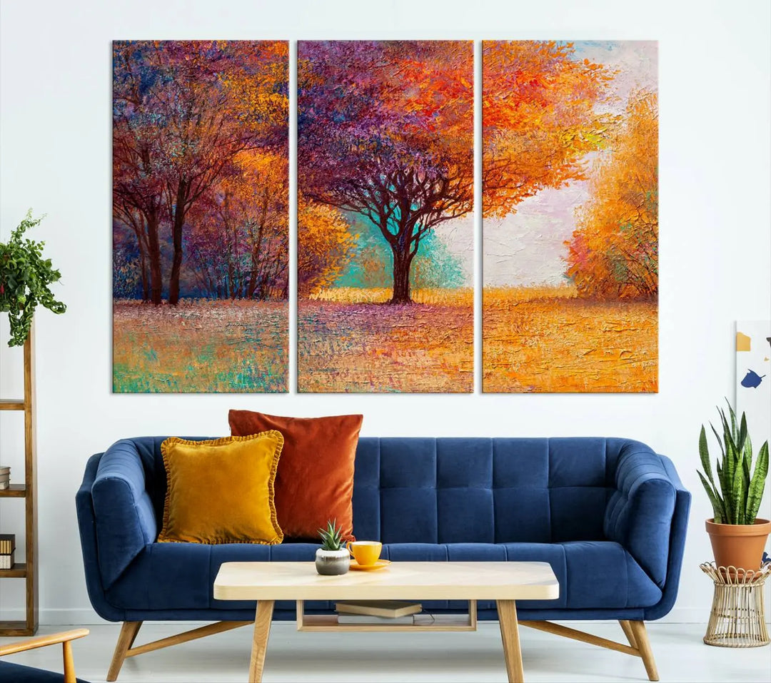 The "Colorful Tree in Autumn" wall art canvas print features a three-panel depiction of a vibrant autumn landscape, gallery wrapped on museum-quality polycotton with UV-protective coating, enhancing the wall in a stylish living room.