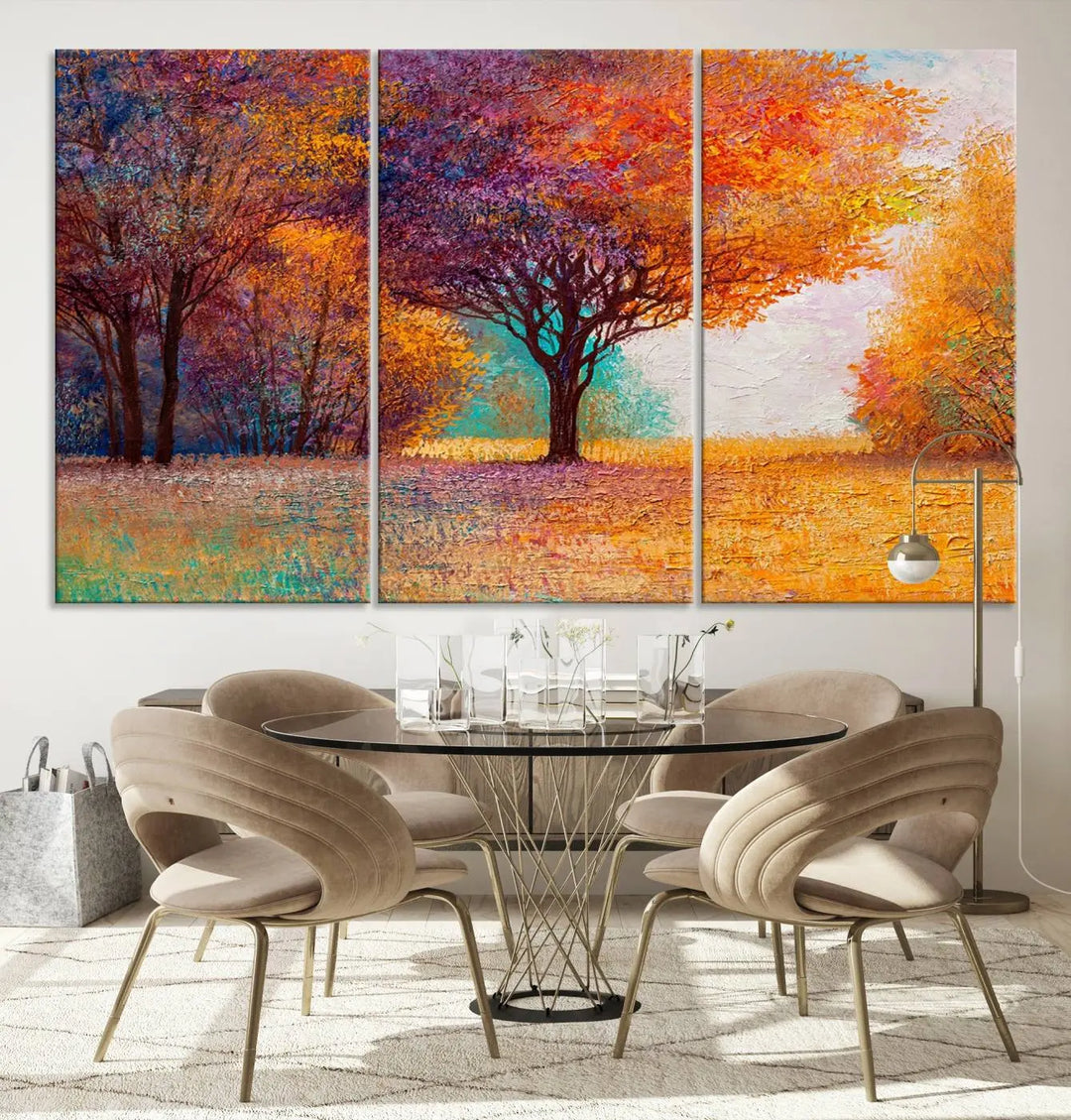 The "Colorful Tree in Autumn" wall art canvas print features a three-panel depiction of a vibrant autumn landscape, gallery wrapped on museum-quality polycotton with UV-protective coating, enhancing the wall in a stylish living room.