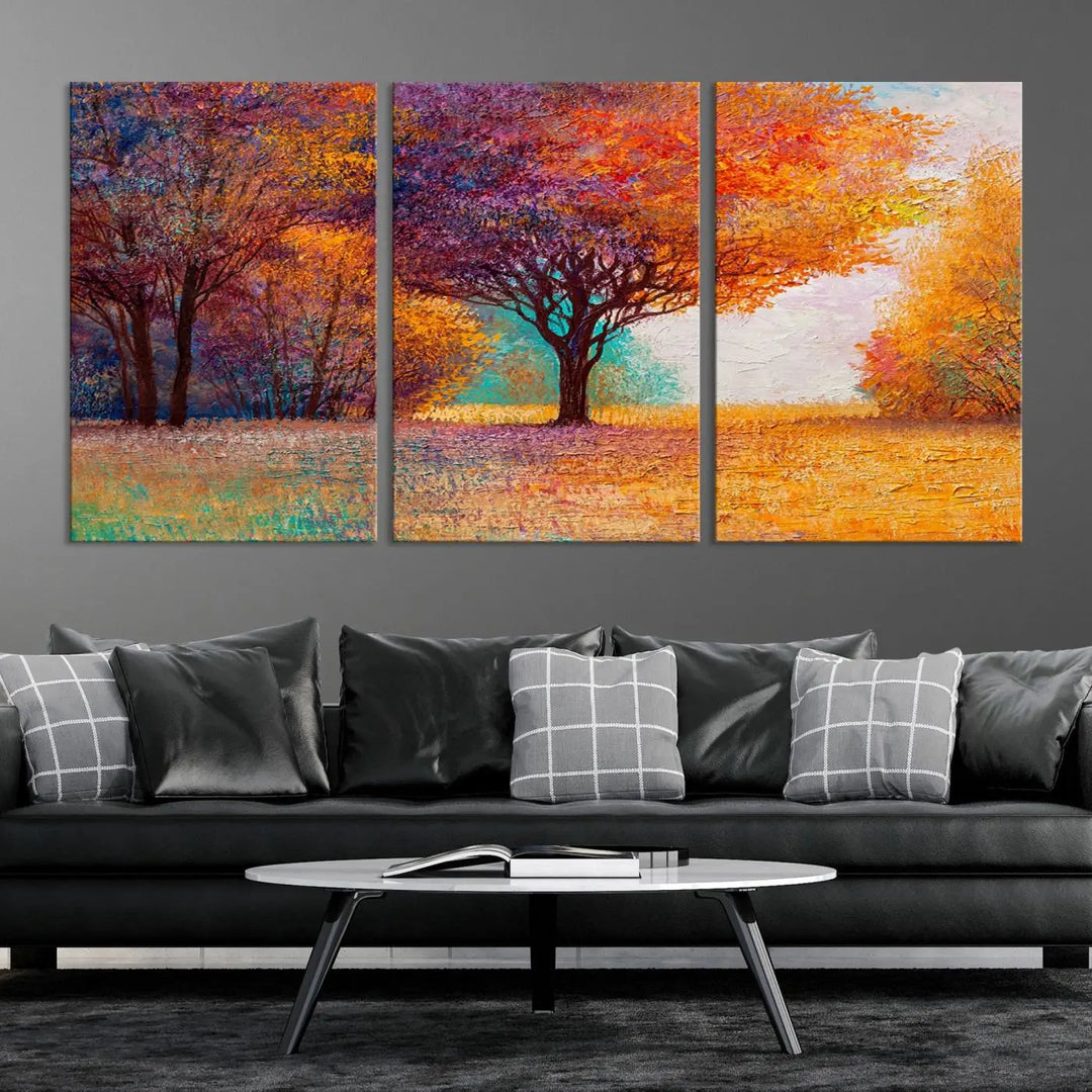 The "Colorful Tree in Autumn" wall art canvas print features a three-panel depiction of a vibrant autumn landscape, gallery wrapped on museum-quality polycotton with UV-protective coating, enhancing the wall in a stylish living room.