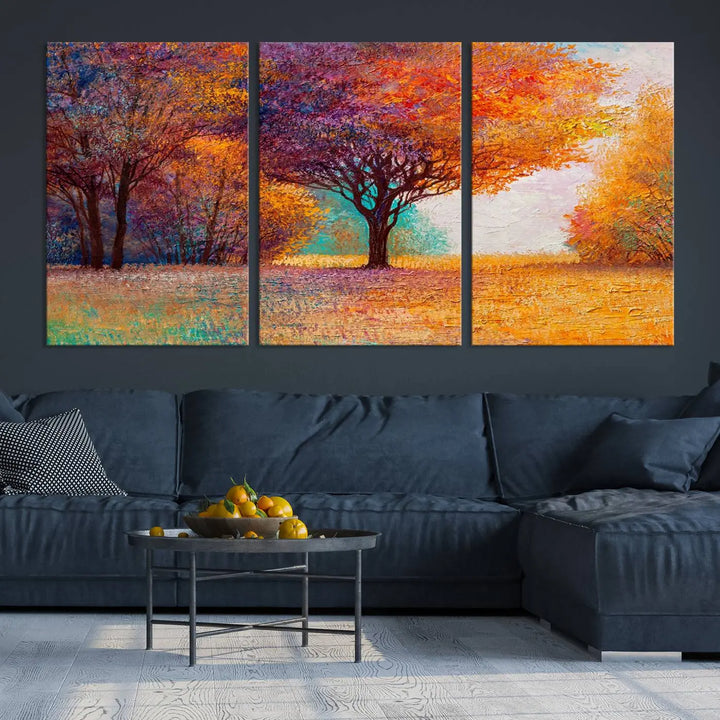 The "Colorful Tree in Autumn" wall art canvas print features a three-panel depiction of a vibrant autumn landscape, gallery wrapped on museum-quality polycotton with UV-protective coating, enhancing the wall in a stylish living room.