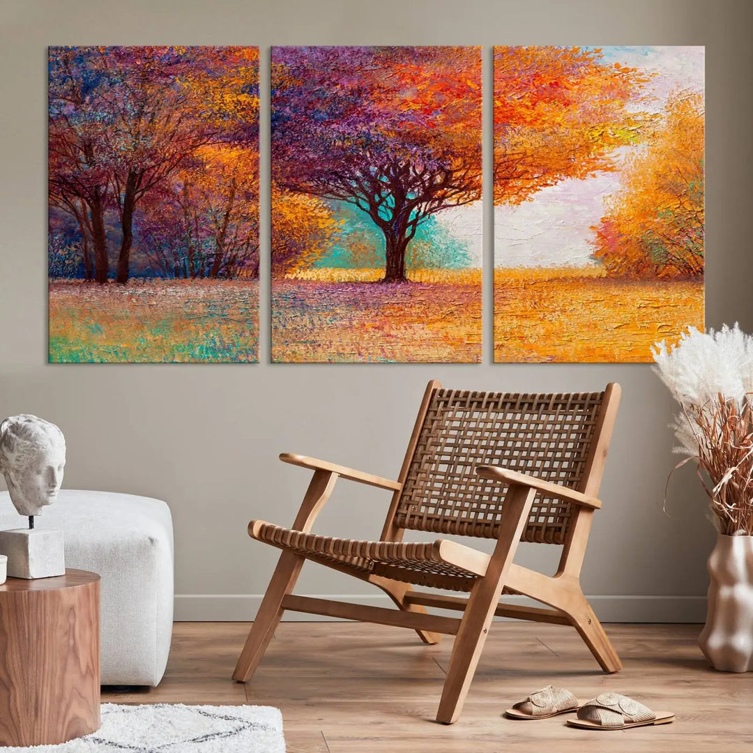 The "Colorful Tree in Autumn" wall art canvas print features a three-panel depiction of a vibrant autumn landscape, gallery wrapped on museum-quality polycotton with UV-protective coating, enhancing the wall in a stylish living room.