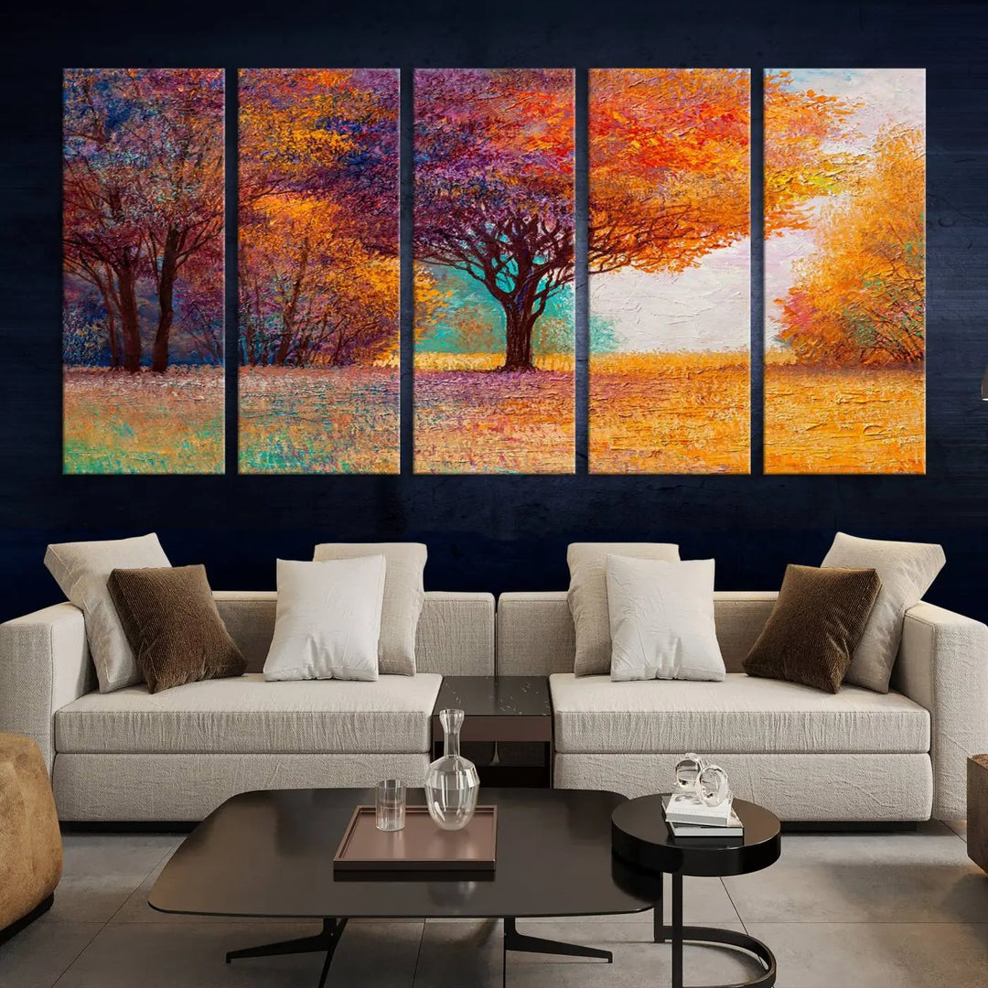 The "Colorful Tree in Autumn" wall art canvas print features a three-panel depiction of a vibrant autumn landscape, gallery wrapped on museum-quality polycotton with UV-protective coating, enhancing the wall in a stylish living room.