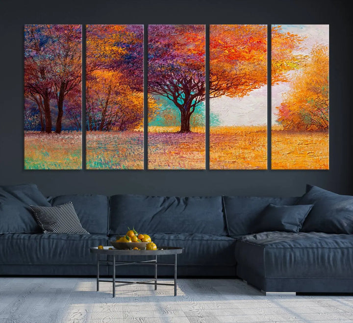 The "Colorful Tree in Autumn" wall art canvas print features a three-panel depiction of a vibrant autumn landscape, gallery wrapped on museum-quality polycotton with UV-protective coating, enhancing the wall in a stylish living room.