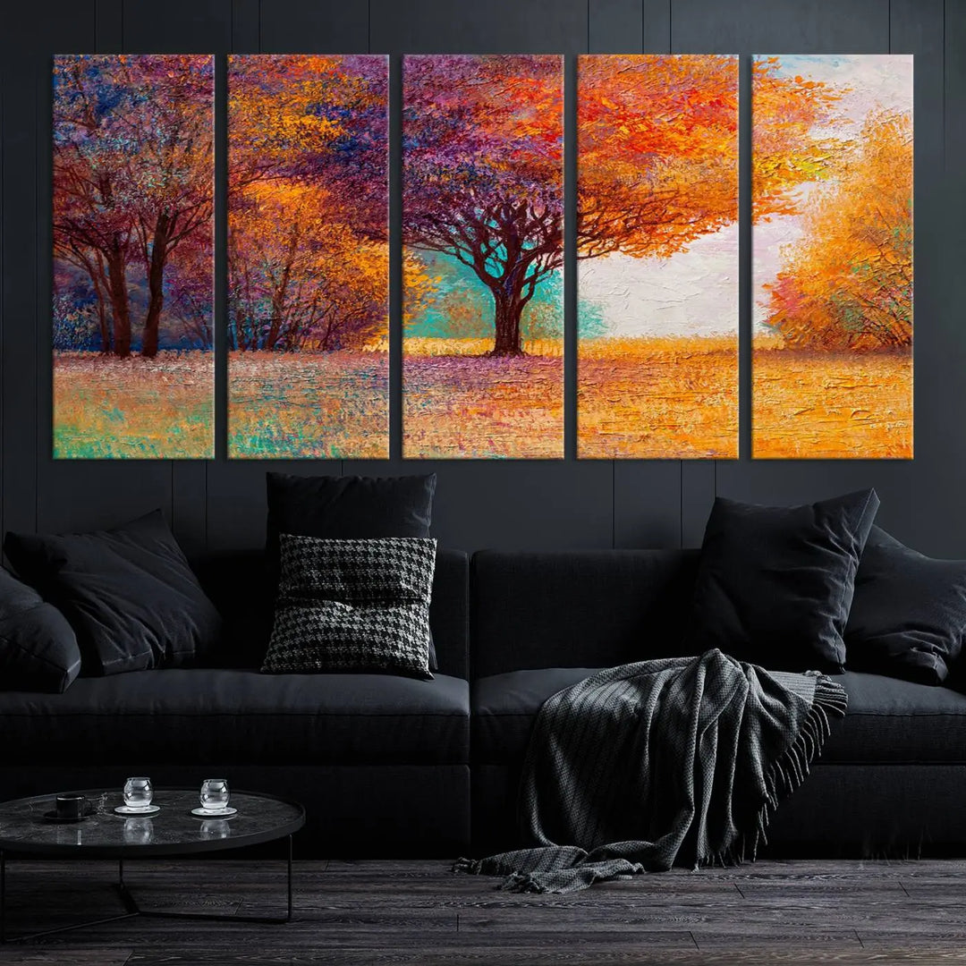 The "Colorful Tree in Autumn" wall art canvas print features a three-panel depiction of a vibrant autumn landscape, gallery wrapped on museum-quality polycotton with UV-protective coating, enhancing the wall in a stylish living room.