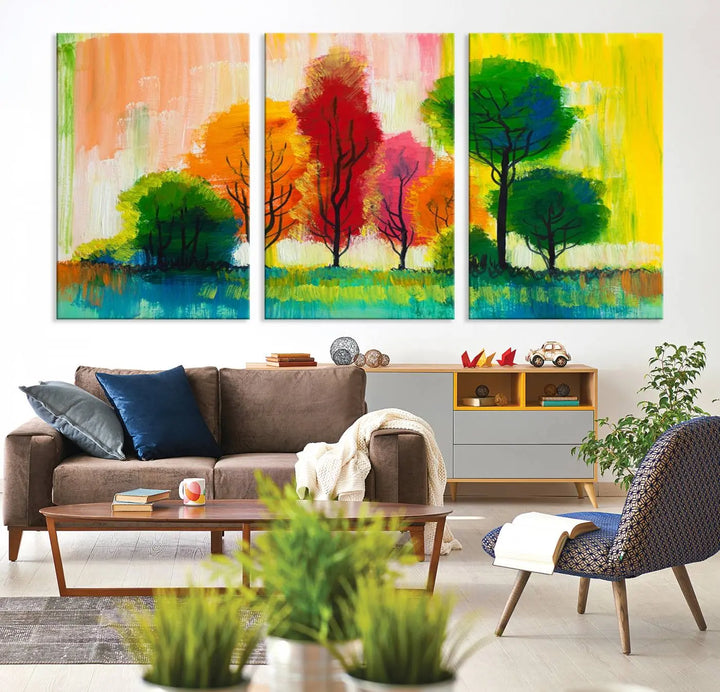 A modern living room features the "Colorful Trees Wall Art Canvas Print" on museum-quality canvases.